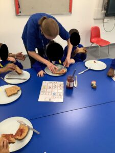 making jam on toast